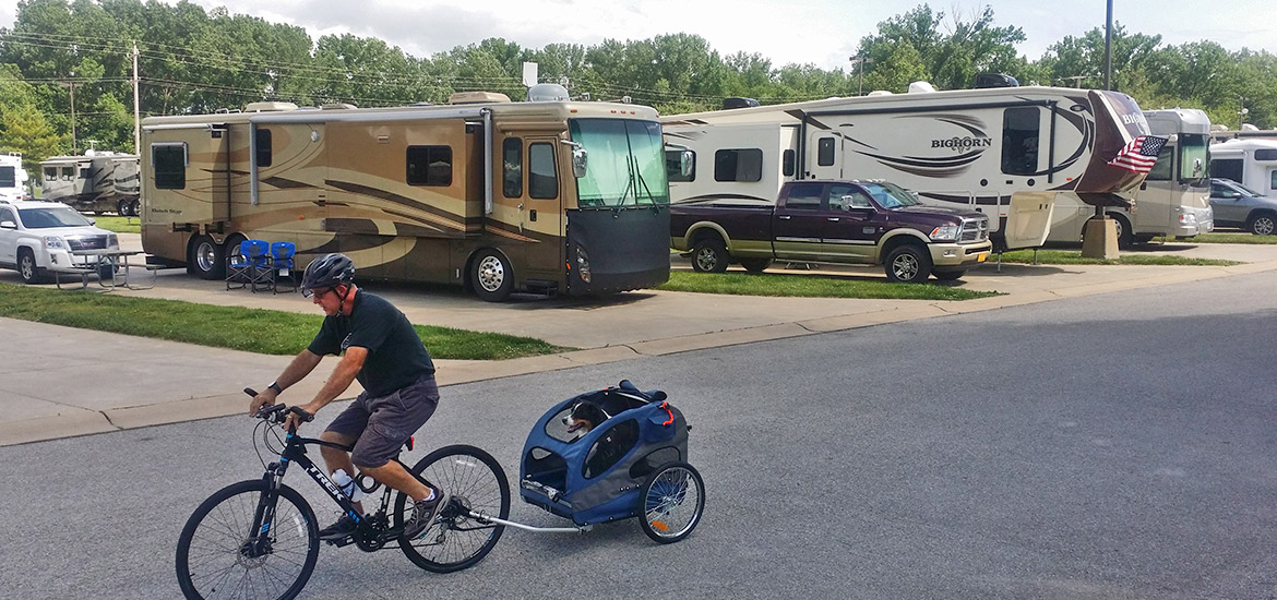 Camper Biking with Dog in Carriage